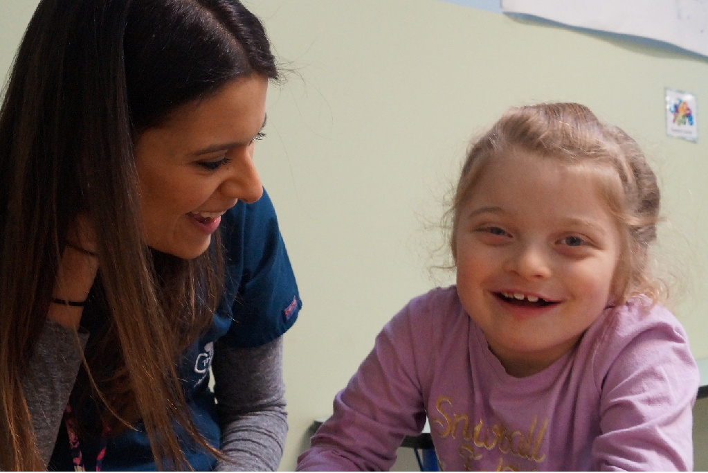 Girl smiling with therapist